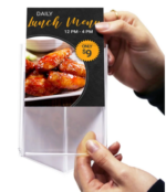 Clear three-sided acrylic tabletop display stand featuring a restaurant lunch menu promotion with images of a burger and chicken wings, designed for multi-angle visibility